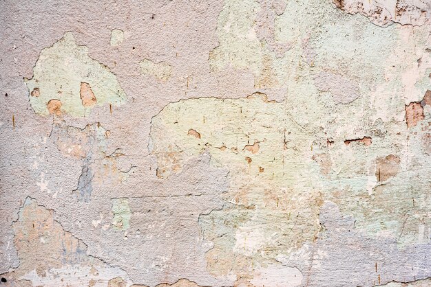 Tekstura, ściana, beton, może służyć jako tło. Fragment ściany z zadrapaniami i pęknięciami