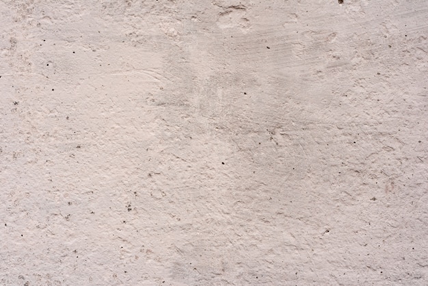 Tekstura, ściana, betonowy tło. Fragment ściany z zadrapaniami i pęknięciami