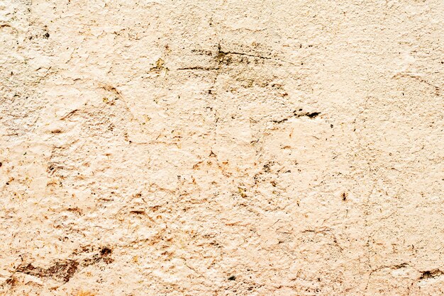 Tekstura ściany betonowe tło. Fragment ściany z rysami i pęknięciami
