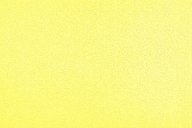 Tekstura ściany żółtego betonu Tło