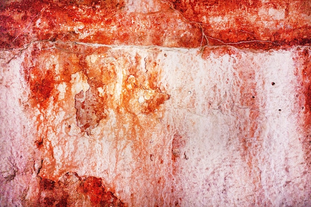 Tekstura starego betonu barwionego pomarańczową farbą pęka i smugi tło pola tekstowego dla napisu tło dla kaligrafii