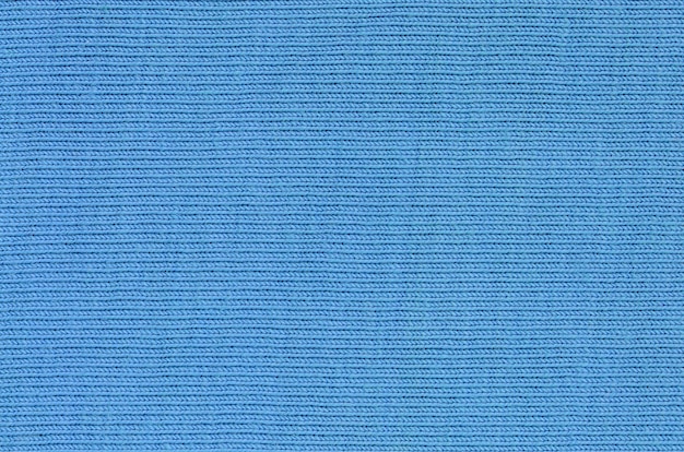Zdjęcie tekstura tkaniny w kolorze niebieskim. materiał do produkcji koszul i bluzek