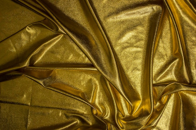 Zdjęcie tekstura tkaniny złote tło fali tkaniny