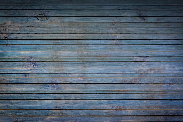 Tekstura tła drewna z niebieskim odcieniem, niewyraźne i nieostrość.
