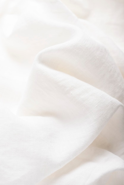 Zdjęcie tekstura tło tkaniny lnianej w naturalnym kolorze białym. koncepcja szycia