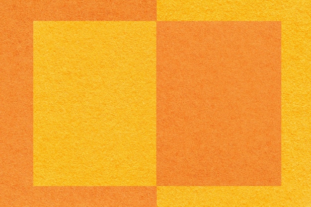 Tekstura żółtego i pomarańczowego tła papieru z geometrycznym wzorem makro Struktura tektury rzemieślniczej z ramą
