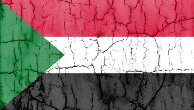 Teksturowane zdjęcie flagi Sudanu z pęknięciami