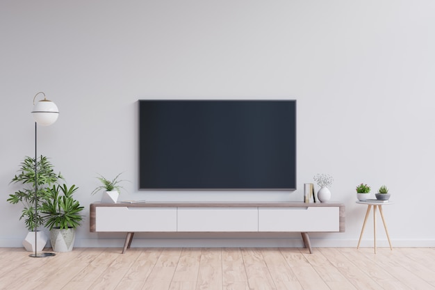 Telewizor na szafce w nowoczesnym salonie na białej ścianie