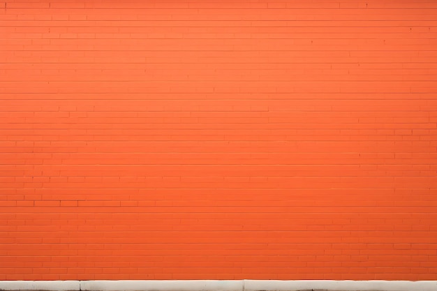 Tętniący życiem miejski urok pomarańczowy mur z cegły w tle