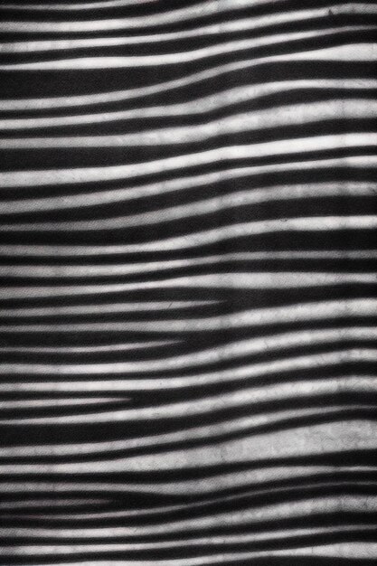 Zdjęcie tkanina w czarno-białe paski z białym tłem.