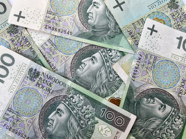 Tło banknotów sto złotych. Faktura banknotów stuzłotowych. Waluta Polski