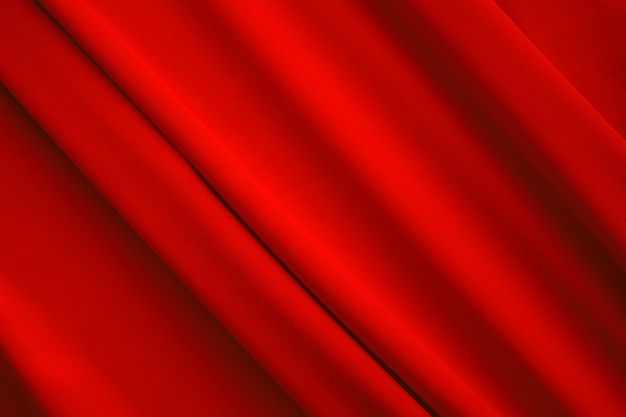 Tło czerwone tkaniny. ozdoba fala gładka tekstura tkanina wyświetlacz luksusowe tapety tło. wolne miejsce na dodawanie tekstu lub produktów. na Boże Narodzenie lub szczęśliwego nowego roku, koncepcja technologii.