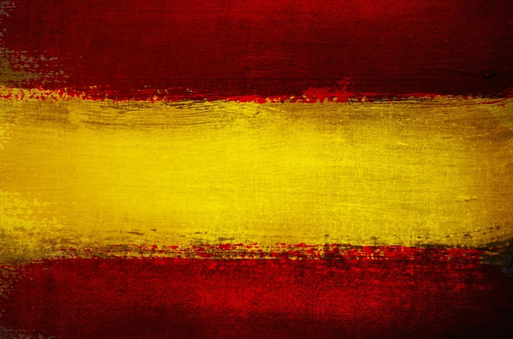 Zdjęcie tło grunge w kolorach flagi hiszpańskiej