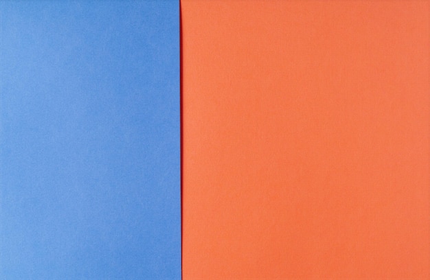 Tło niebieskiego i czerwonego papieru w jasnych kolorach geometryczny wzór