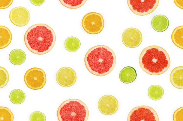 Tło Owoce Cytrusowe. Wzór Z Kawałkami Pomarańczy, Cytryny, Limonki, Grejpfruta.