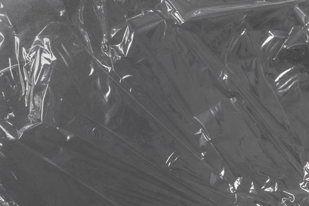 Tło papieru z folii aluminiowej Zdjęcie tekstury losowo zmiętego arkusza folii aluminiowej