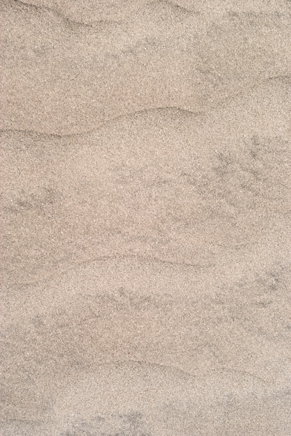 Zdjęcie tło - pustynne wydmy z bliska, zmarszczki na powierzchni piasku