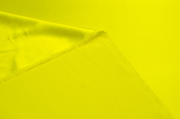 Tło tekstura żółta tkanina