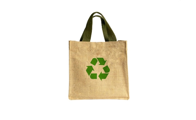 Zdjęcie torby z tkaniny ekologicznej puste lub z przędzy bawełnianej torby z tkaniny puste torby i zielony symbol recyklingu na białym tle