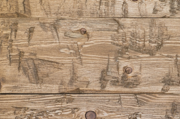 Trzy stare drewniane deski pokryte tłem agenta ochronnego