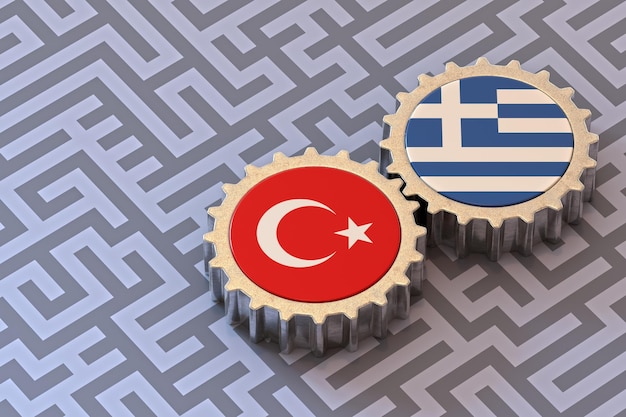 Zdjęcie turcja i grecja flagi na koła zębate izolowane na tle labiryntu