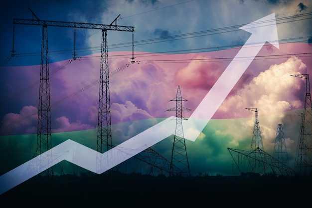 Unosząca się strzała w górę przeciwko niemieckiej fladze i sylwetce linii energetycznej oraz burzliwemu niebu Wzrost cen energii elektrycznej Kryzys energetyczny w Niemczech Niedobór energii elektrycznej Ogromne koszty energii