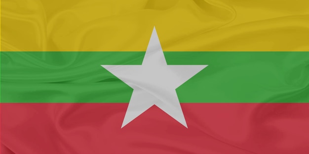 Wiatr macha flagą Mjanmy z bliska