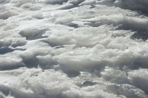 Wiatr w formie lodu tekstury na powierzchni śniegu w zimie