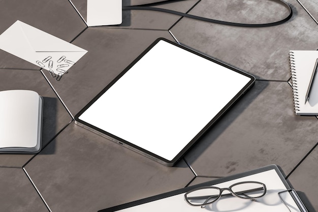Widok perspektywiczny na pusty biały nowoczesny ekran tabletu cyfrowego z miejscem na logo lub tekst na powierzchni płytek betonowych wśród narzędzi biurowych i dokumentów Makieta renderowania 3D