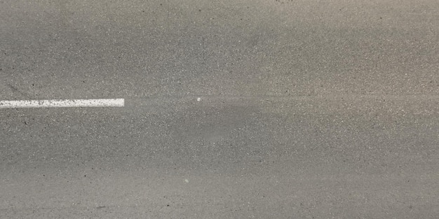 Zdjęcie widok z góry na teksturę asfaltowej drogi z pęknięciami
