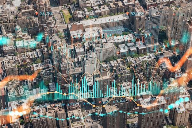 Zdjęcie widok z lotu ptaka na dachy budynków nowego jorku widok z lotu ptaka z helikoptera na panoramę metropolii hologram wykresu forex koncepcja pośrednictwa w handlu internetowym i analiza fundamentalna