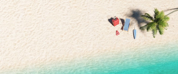 Widok z lotu ptaka na piaszczystą plażę i ocean oraz klapki na plażę, parasol i walizkę pod palmą na plaży podczas letnich wakacji na Karaibach, rozmiar banera, miejsce na kopię