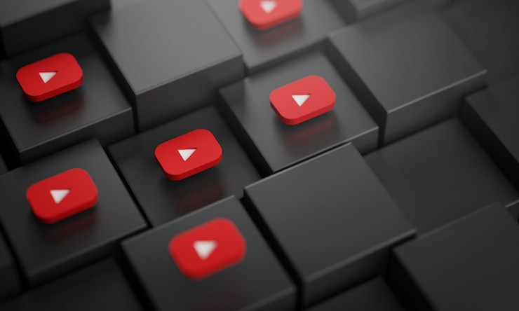 Zdjęcie wiele logo youtube na czarnych kostkach