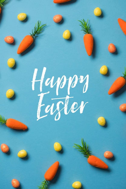 Wielkanocne świąteczne tło z wielkanocnymi marchewkami i pisanki