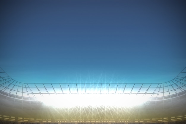 Zdjęcie wielki stadion futbolowy pod niebieskim niebem