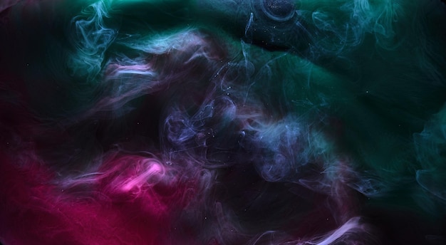 Wielobarwny ciemny dym na czarnym tle atramentu kolorowa mgła abstrakcyjna wirująca dotyk ocean morze akrylowa farba pigmentowa pod wodą