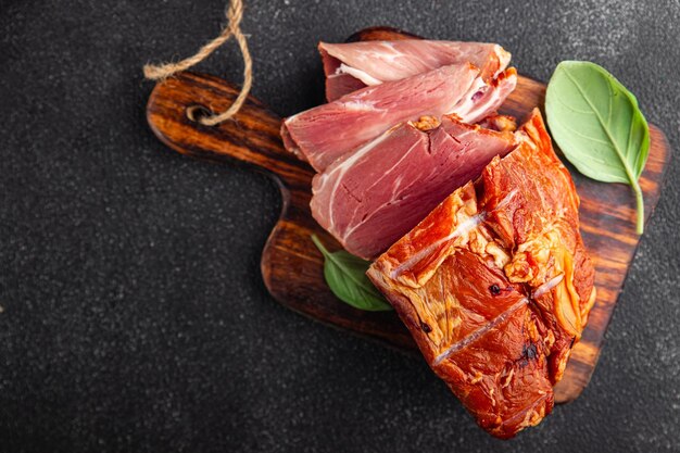 Zdjęcie wieprzowina wędzone mięso przysmak jedzenie posiłek jedzenie przekąska na stole kopiować przestrzeń jedzenie tło wiejskie
