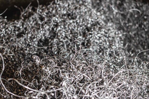 Wióry metalowe Tło Odpady po obróbce metalu na tokarce