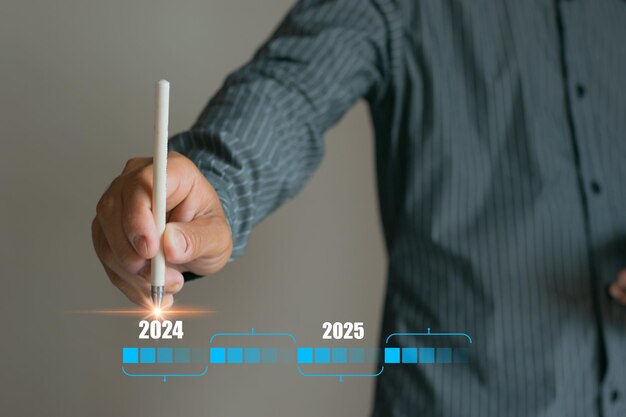 Zdjęcie witam nowy rok 2024 dotknij ręki wirtualnego ekranu w 2024 nowe liczby na przyszły rok przedsiębiorcy dotykają przyszłego wzrostu od 2023 do 2024 planowanie możliwości biznesowych strategia biznesowa