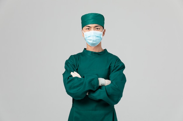 Wizerunek lekarza płci męskiej w fartuchu chirurgicznym przeciw epidemii