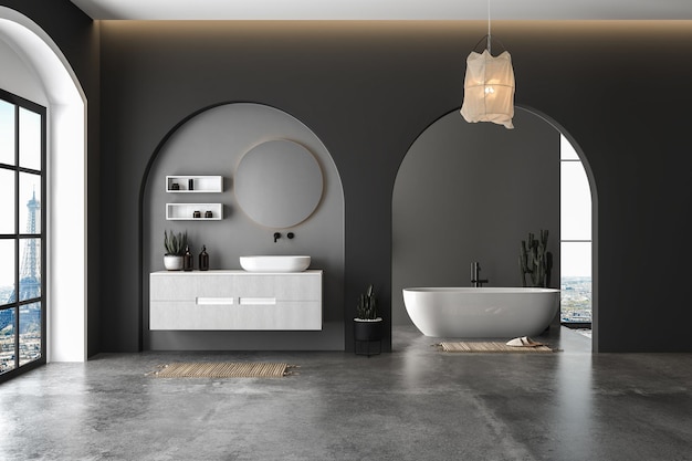 Wnętrze nowoczesnej łazienki z betonowymi i czarnymi ścianami, betonową podłogą i białą umywalką.