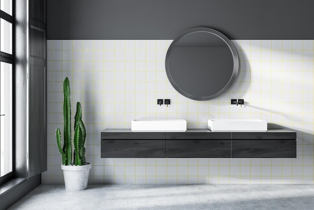 Wnętrze nowoczesnej łazienki z szarymi i białymi ścianami z płytek, betonową podłogą, podwójną umywalką stojącą na czarnym drewnianym blacie i okrągłym lustrem. renderowania 3D