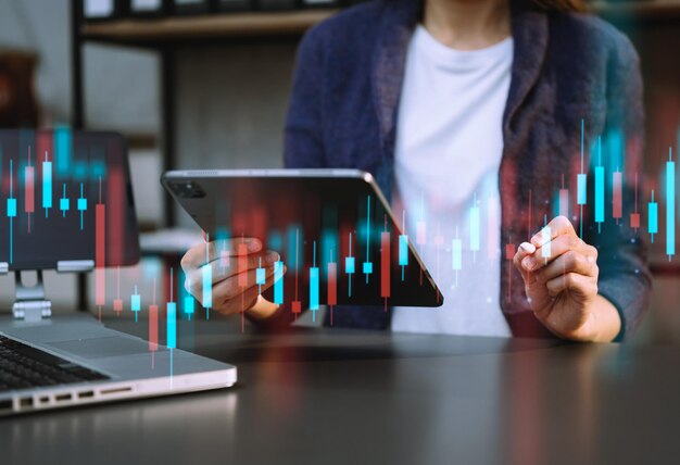 Wykres wzrostu handlu w zakresie biznesu i inwestycji oraz analizy biznesu w zakresie finansów na rynku akcji z wykorzystaniem tabletów cyfrowych i technologii cyfrowych xAxA