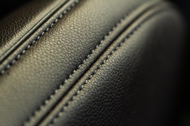Wysoki kąt widzenia nowoczesnych siedzeń z tkaniny samochodowej Zbliżenie tekstury fotelika samochodowego i szczegółów wnętrza Szczegółowy obraz ściegu plis samochodowych Skórzane siedzenia