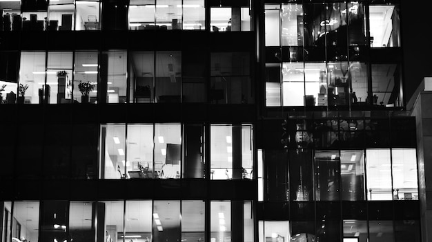 Wzorzec budynków biurowych okna oświetlone w nocy Architektura szklana budynek korporacyjny