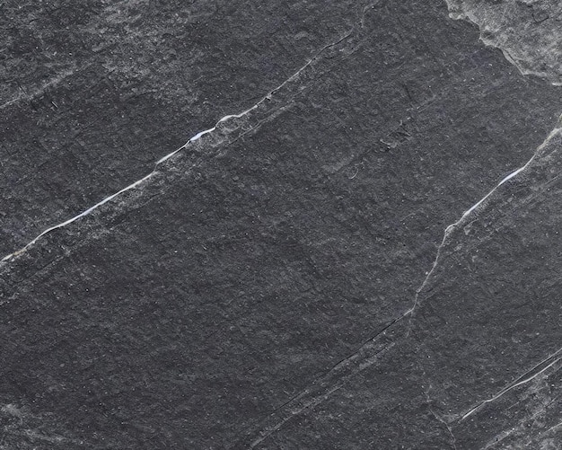 Zdjęcie wzorzec tła z naturalnego czarnego kamienia łupkowego o wysokiej rozdzielczości