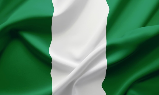 Z bliska macha flagą Nigerii
