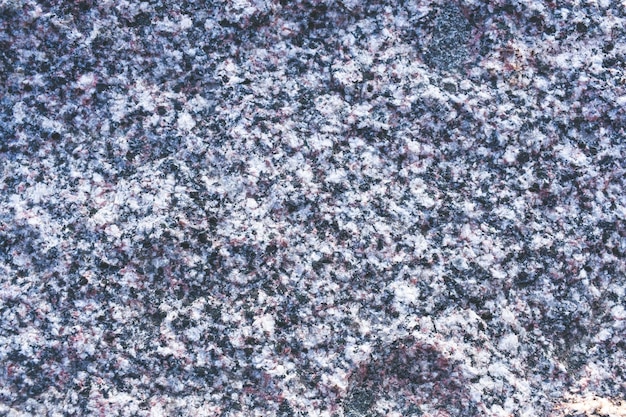 Zdjęcie z granitu. kamienna tekstura z ziarnistym wzorem.