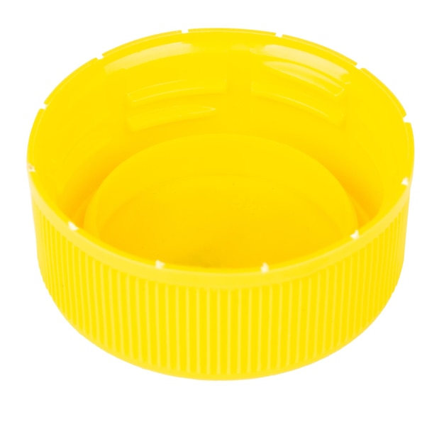 Zakrętka plastikowa żółta na białym tle