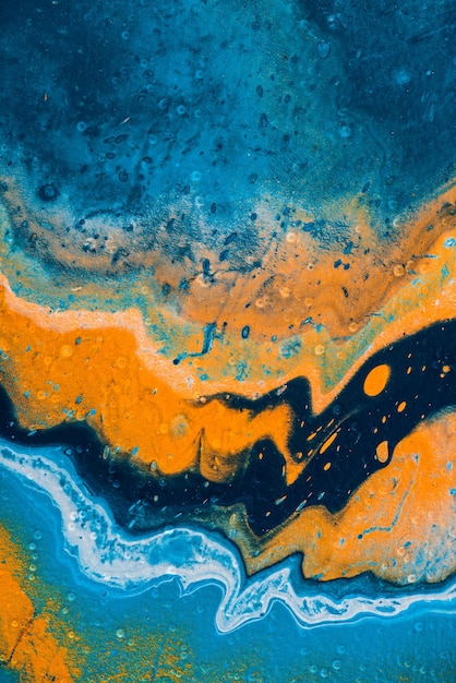 Zbliżenie abstrakcyjne tło z niebieską i pomarańczową farbą olejną